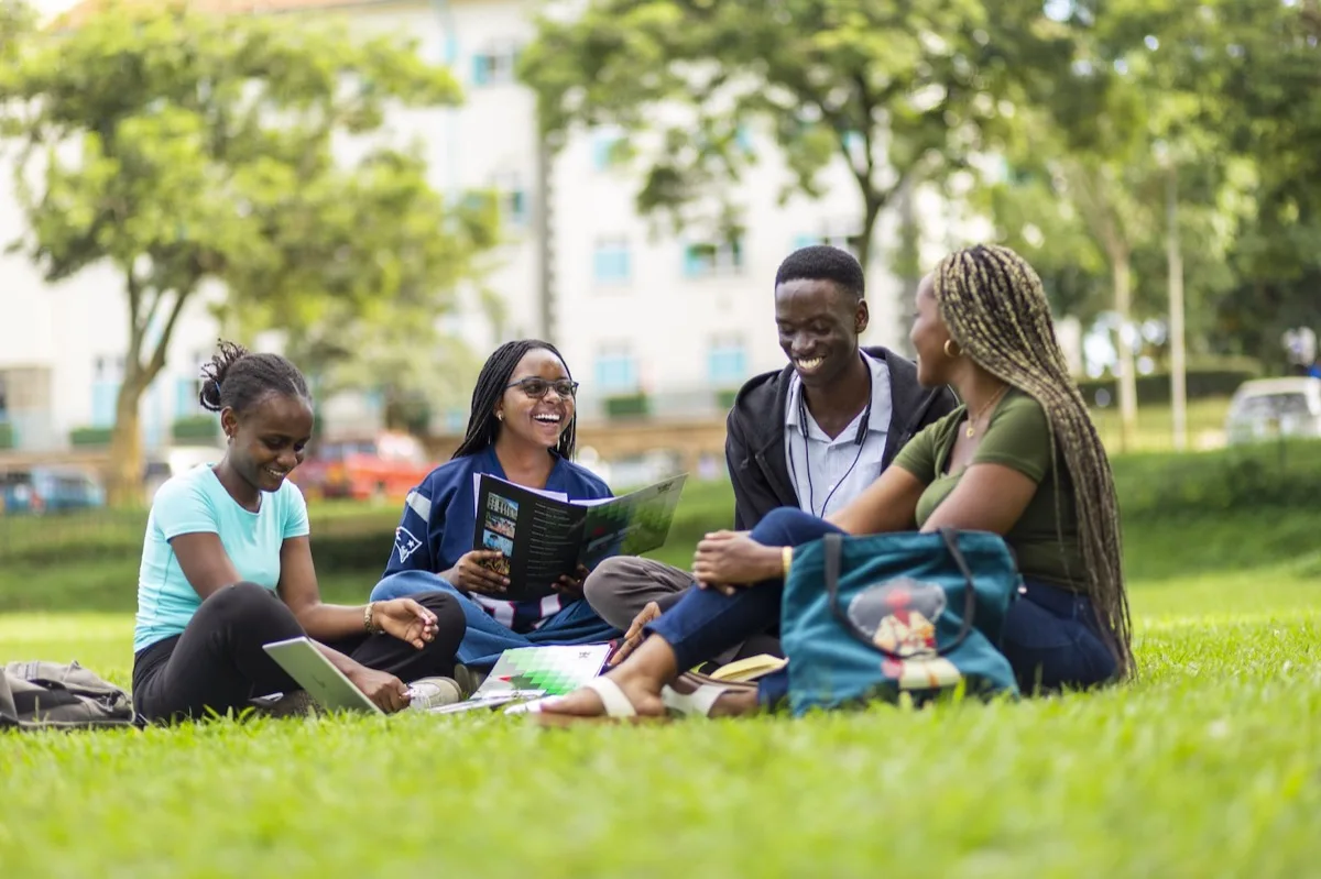 Makerere University students studying together on campus